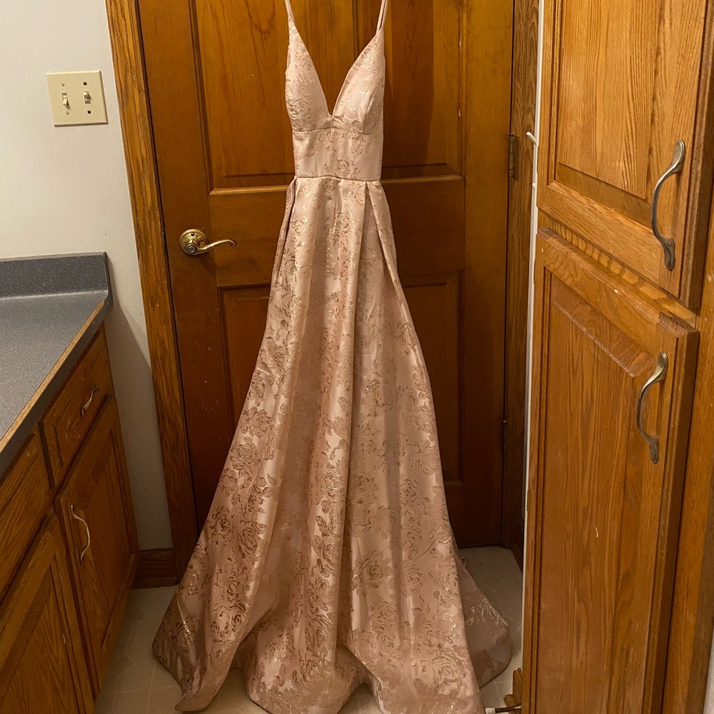Light pink prom dress worn once. Cross-cross back, pockets, and beautiful detail